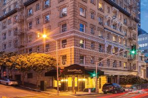 The outside of WorldMark San Francisco resort lit up at night.